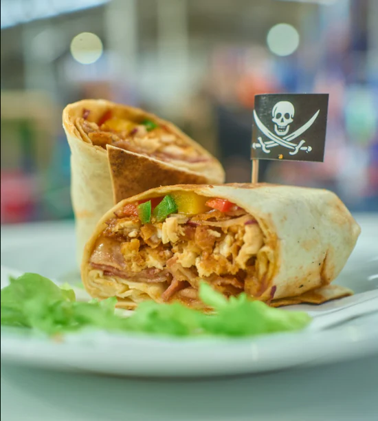 Chicken wrap served with a Pirates Adventure flag